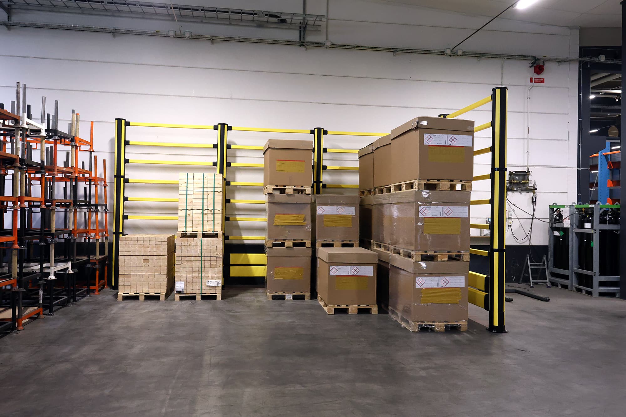 Impact protection with pedestrian protection in a warehouse environment with crates of goods on top of pallets