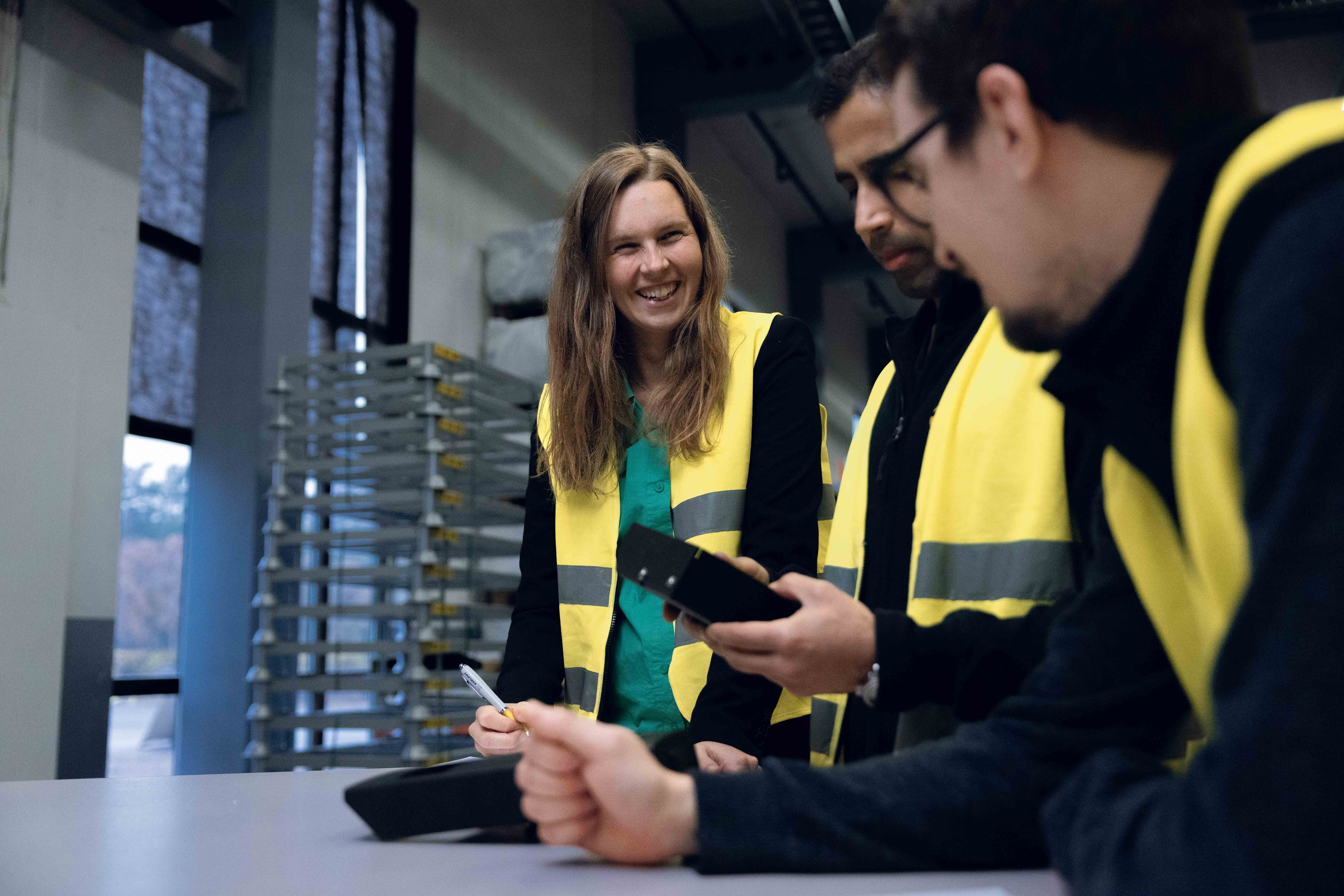 three people in safety vests