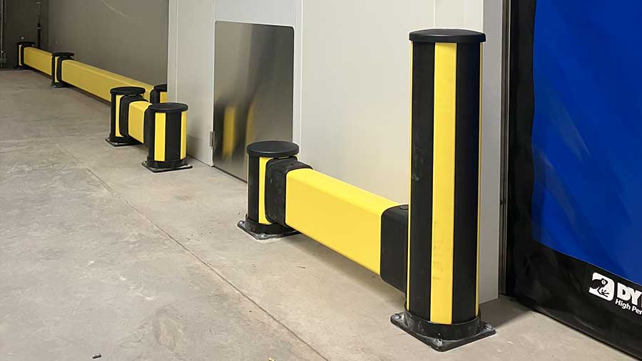 low impact barrier combined with impact bollard protection wall in warehouse environment