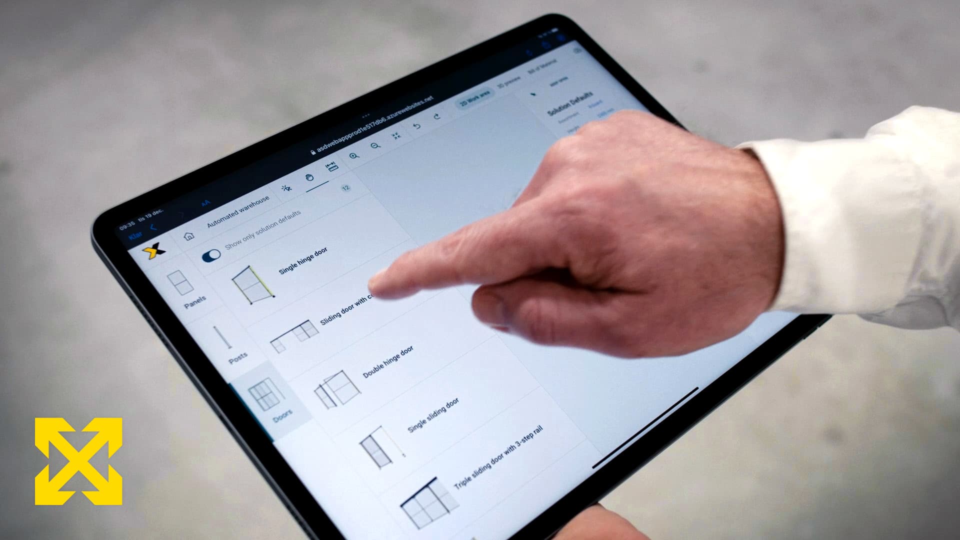 Finger pointing on a tablet showing Axelent Safety Design tool