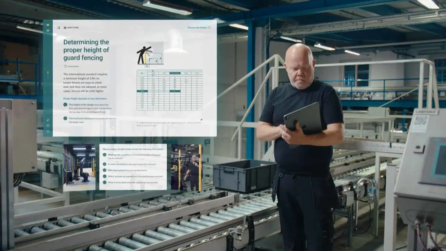 Man in production using the Axelent Saftey Book to increase safety  Man in production using the Axelent Saftey Book to increase safety