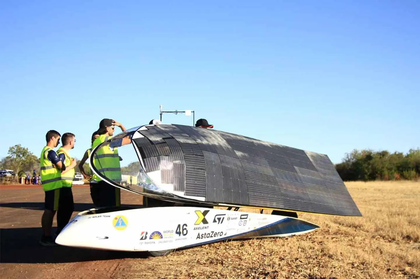Solar car Nova Lumia by the side of a road with the roof open