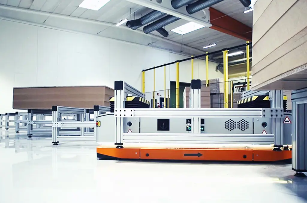 Autonomous Mobile Robot (AMR) transporting goods through an industrial warehouse