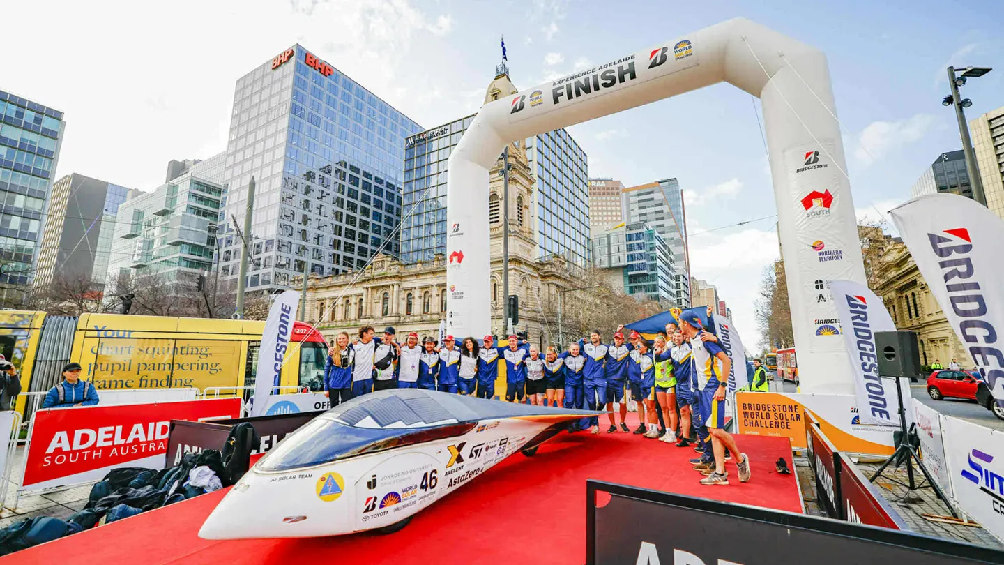 The entire JU Solar Team 2025 at the finish line right when the solar car Nova Lumina crossed after completing the Bridgestone World Solar Challenge