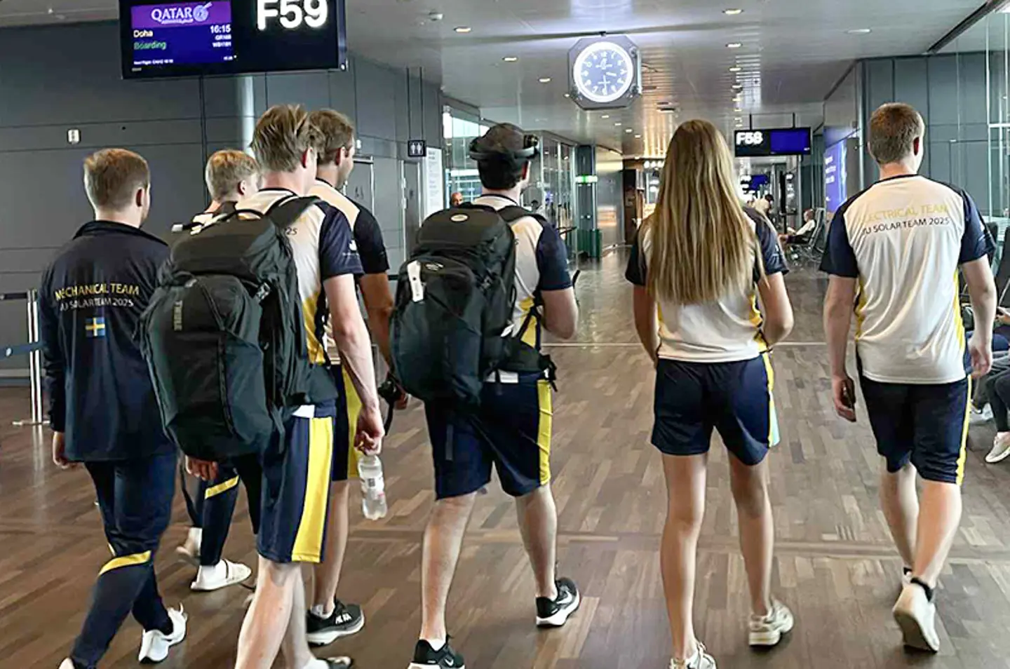 Members of the JU Solar Team walking in an airport