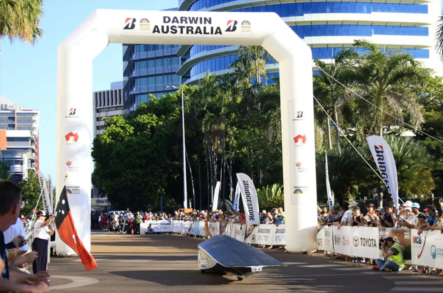 Solar car Nova Lumina crossing the startline in Darwin during the Bridgestone World Solar Challenge