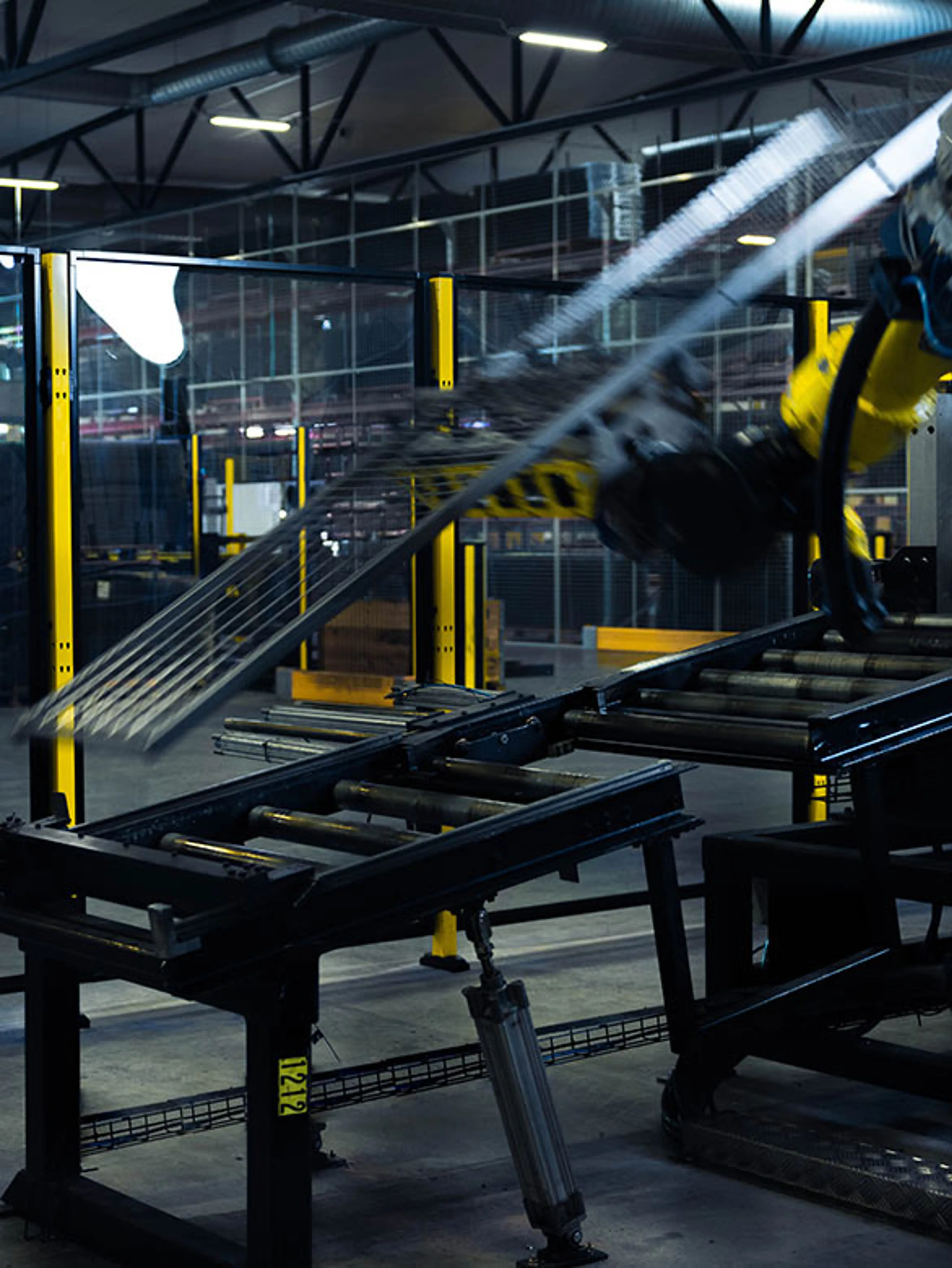 Moving machine with transparent plastic machine guards in the background